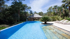 Paradisiacal villa surrounded by a tropical garden near Santa Eulalia